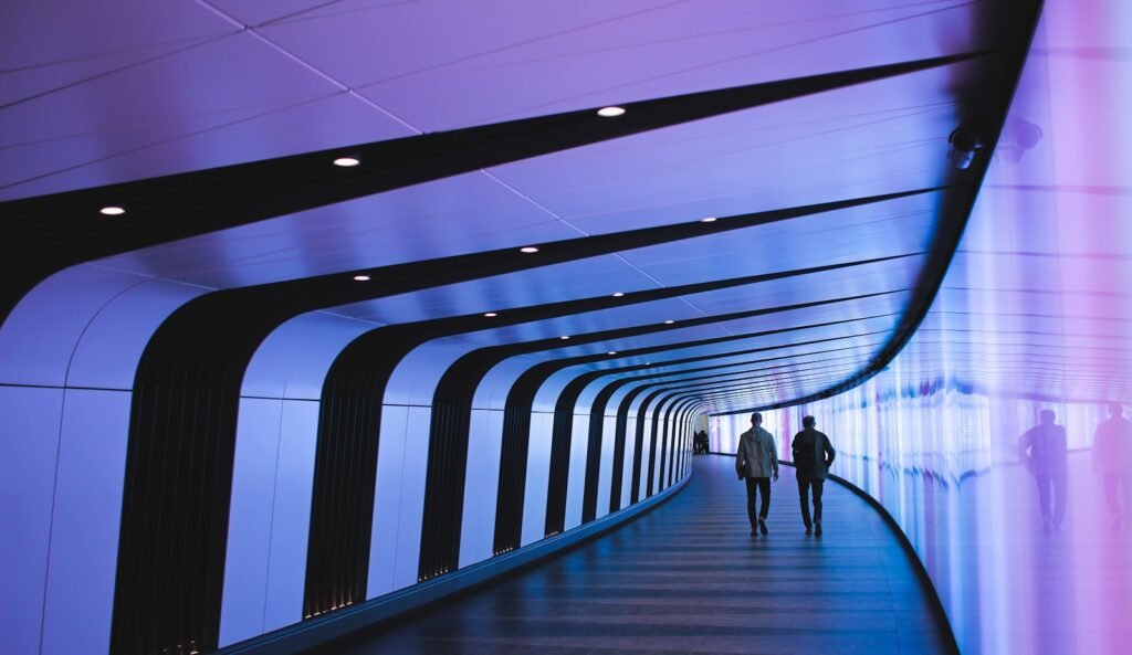 man walking through pathway